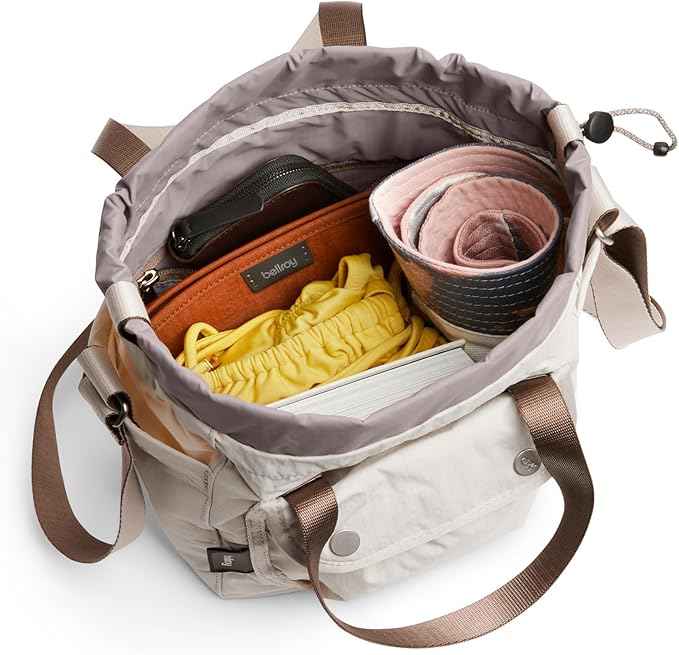 Bellroy Cinch Bucket Bag (compact 9 liter lightweight crossbody bag with external organization, internal zip pocket, adjustable shoulder strap, and adapts to be carried three ways) - Oat