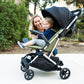 Joovy Kooper Lightweight Baby Stroller Featuring Removable, Swing-Open Tray, Big Wheels, Reclining Seat with Footrest, Extra-Large Retractable Canopy, and Compact Fold (Olive)