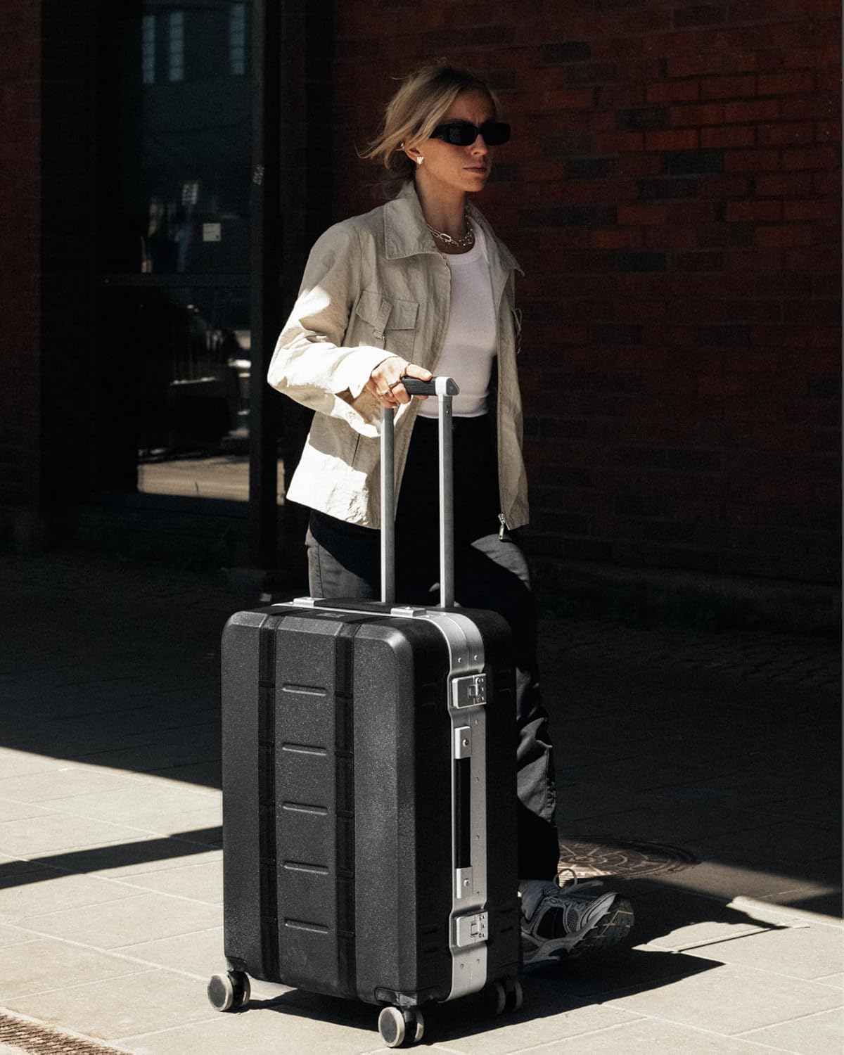 D_b_ Ramverk Pro Medium Check-In 25 Inch Hardside Luggage Extra Protection Aluminum Frame, Silent 360 Spinner Wheels, TSA Lock, Interior Laptop Compartment - Silver Frame/Black - Roamly