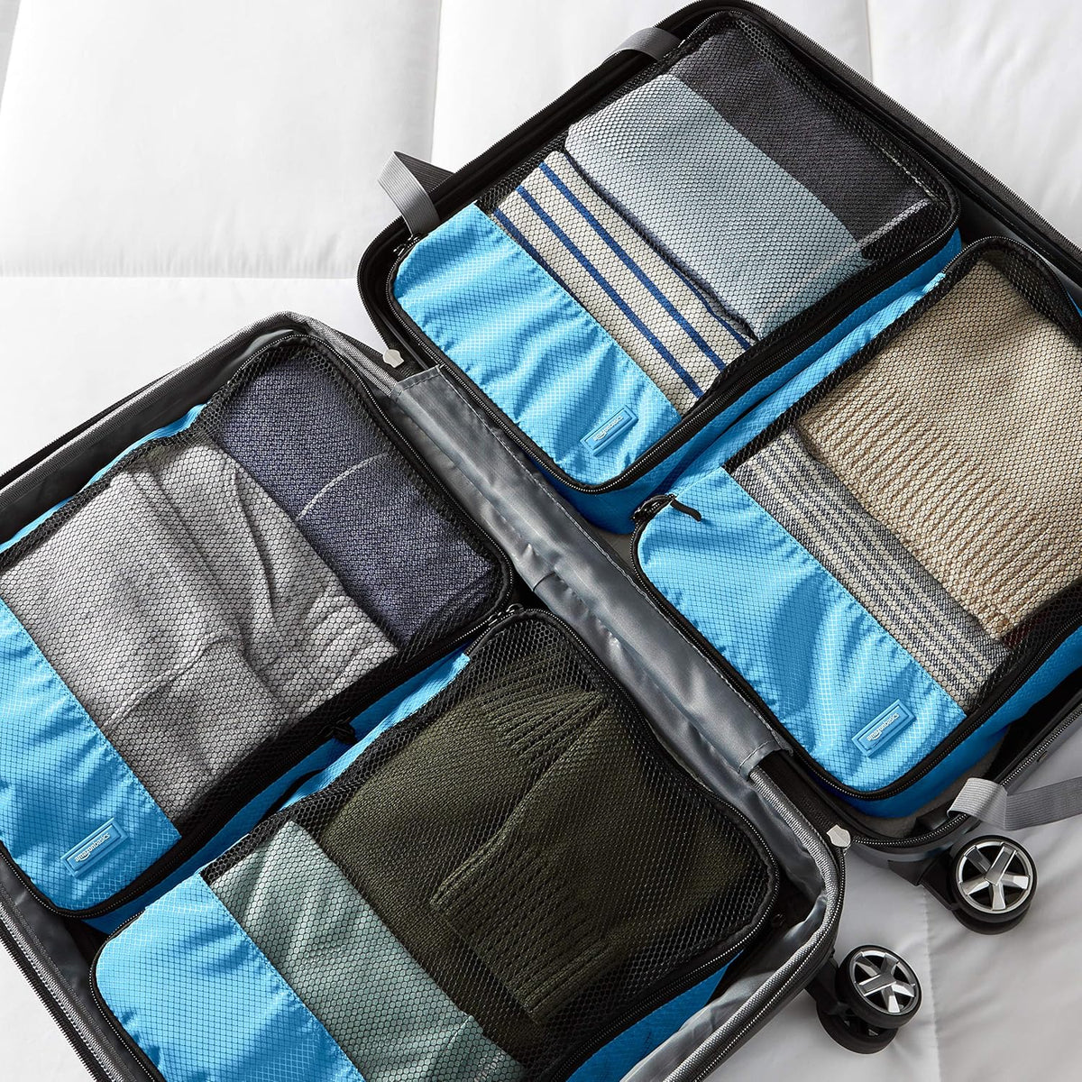 Amazon Basics Medium Packing Cubes for Travel, Packing Organizers, 4-Piece-Set With Double Zipper Pulls and Mesh Top Panel, 100% Durable Polyester, Sky Blue, 13.8"L x 9.8"W x 3"H - Roamly